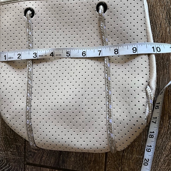 NWOT ah•dorned Neoprene perforated shoulder tan bag - Picture 14 of 16